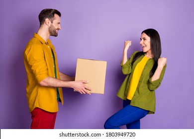Profile side view portrait of his he her she nice attractive glad cheerful friends friendship guy giving box shop sale discount isolated bright vivid shine vibrant lilac violet purple color background