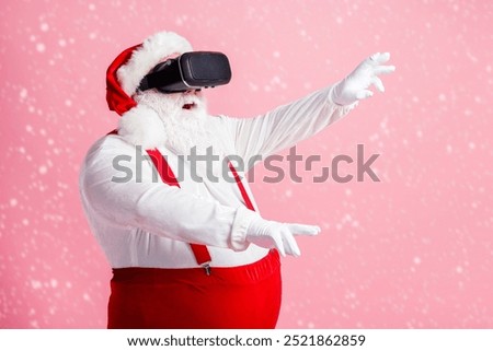 Profile side view portrait of his he nice attractive bearded fat overweight Santa watching vr wear futuristic innovation helmet device enjoying realistic illusion isolated pink pastel color background