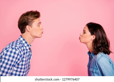 Profile Side View Portrait Of Nice Sweet Charming Adorable Lovely Attractive Flirty Couple Reaching Out To Each Other Closed Eyes Isolated Over Pink Pastel Background