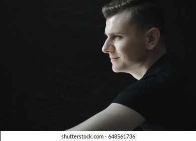 Profile Of Smiling Handsome Young Man Portrait In Low-key Lighting