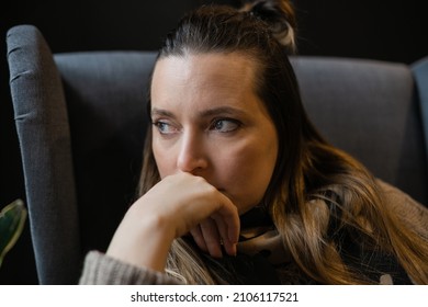 Profile Of Stressed Woman 40 Years Old Sitting Near Window Thinking. Female Person With Depressed Look In Life Crisis. Causian Sad Lonely Lady