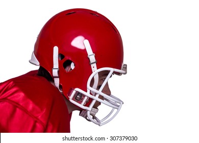Profile View Of An American Football Player Wearing A Red Helmet
