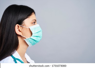 Profile View Of Female Doctor In Studio Shot