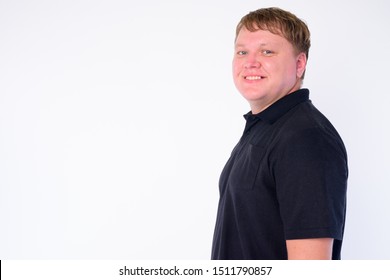 Profile View Of Happy Overweight Man Looking At Camera