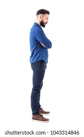 Profile View Of Sad Man With Bent Down Head And Crossed Arms Looking Down. Full Body Isolated On White Background.