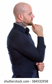 Profile View Of Young Bald Muscular Man Thinking