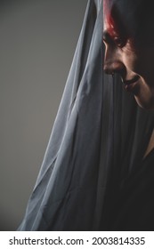 Profile Of A Woman In A Black Veil. Costume Dead Bride For Halloween. Portrait Of An Evil Grinning Witch In Front Of A Coven.