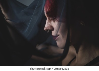 Profile Of A Woman In A Black Veil. Costume Dead Bride For Halloween. Portrait Of An Evil Grinning Witch In Front Of A Coven.