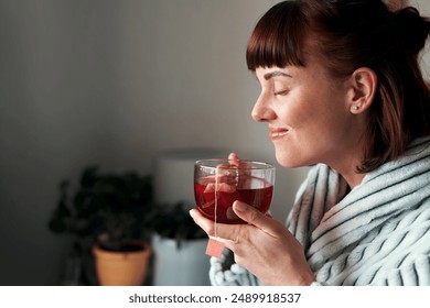 Profile, woman and eyes closed with herbal tea in home to relax with thinking and smile. Female person, cup and happy on break for self care, wellness and wellbeing in morning for mindfulness - Powered by Shutterstock