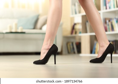 Profile Of Woman Legs With High Heels Walking In The Living Room At Home