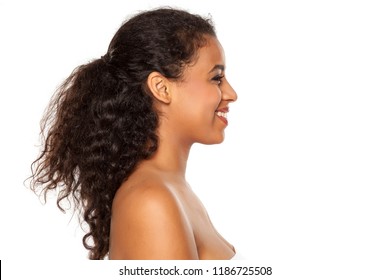 Profile Of Young Beautiful Dark-skinned Woman On A White Background