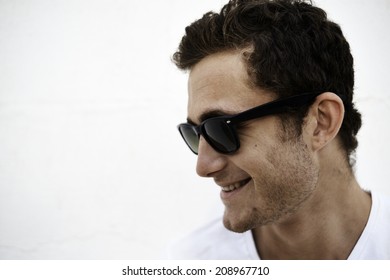 Profile Of Young Man Smiling With Sun Glasses 