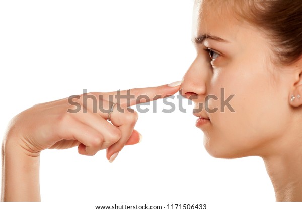 白い背景に若い女性の鼻を触る輪郭 の写真素材 今すぐ編集