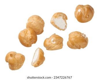 Profiteroles and halves fly close-up on a white background. Isolated - Powered by Shutterstock