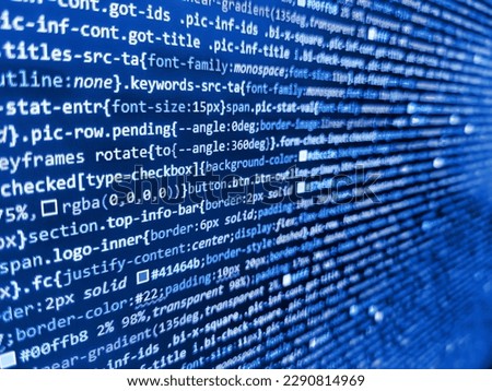 Program code - angle view Modern application Coded data on monitor. Screen of web developing code on dark background. Abstract information digital technology modern background