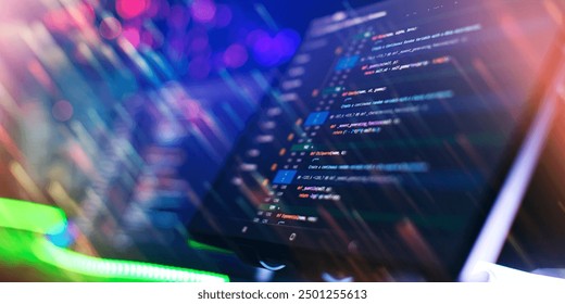 Program code on a computer monitor with fiber optic background. Internet and technology concept.