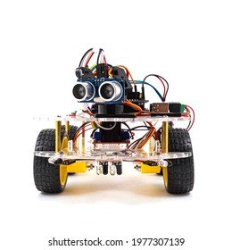 Programmable four wheels drive (4WD) robotic car with obstacle avoidance and line follow ability, isolated on white background with clipping path