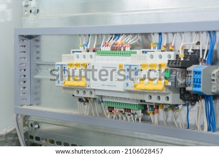 Programmable logic controller, automatic input of power reserve in the electrical cabinet. Close-up, selective focus.