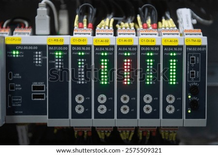 Programmable Logic Controller PLC comprised of analog and digital input and output with power supply and processor module.