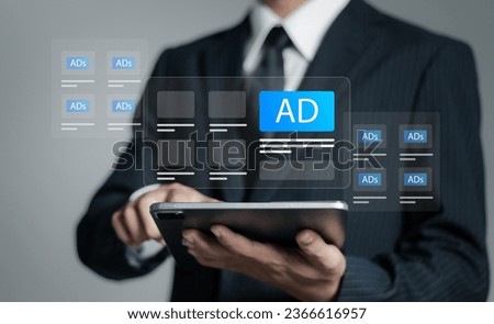 Programmatic advertising concept. Businessman use tablet with advertising on website, planning advertising marketing strategies to target social media native, ad, advertisers, sales, marketing digital