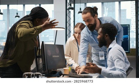 Programmer asks a team leader for help investigating a hacking attempt, critical network alert and unauthorized access with coworkers during cybersecurity incident response