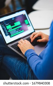 programmer coder working on his laptop. Software development. Programmer coding web application client server. Developer of program code. process of writing code in a special application.
