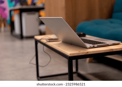 A programmer coding at lap top at coworking space