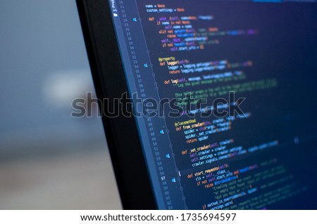 Programmer coding python, java script, html code on notebook screen at home. Work from home. Working process illustration for business.