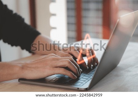 programmer, developer using computer laptop with triangle caution warning sign for notification error and maintenance concept. 