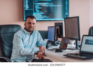 A programmer diligently testing smartphone applications while sitting in their office. - Shutterstock ID 2311984377