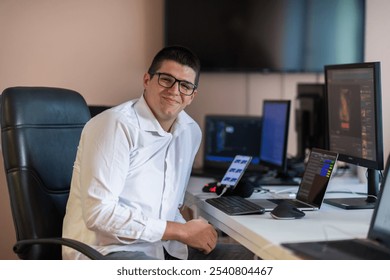 A programmer diligently testing smartphone applications while sitting in their office.