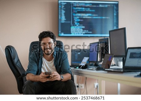 A programmer diligently testing smartphone applications 