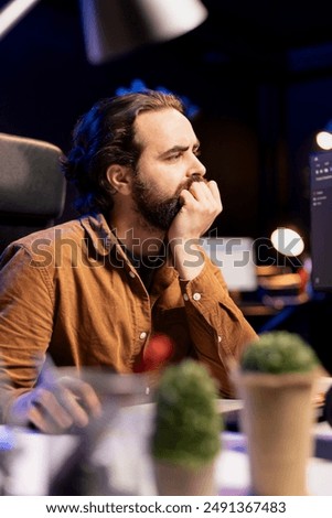 Programmer dismayed by malicious traffic from cybercriminals attempting to steal company data, struggling to filter them. Man shaken by malware attacks, trying to come up with prevention methods