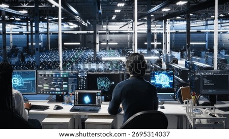 Programmer entering server room office, using AI to review infrastructure diagnostics. IT admin in data center high tech facility analyzes performance data using artificial intelligence tech, camera A