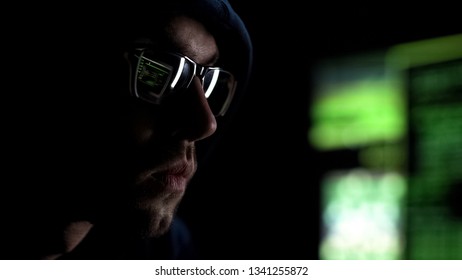 Programmer Intently Looking At Monitor Checking Data, Reflection In Glasses