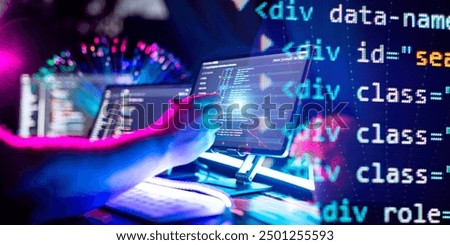 Programmer manually working with program code on a computer at night in a data center  and technology concept.