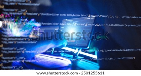 Programmer manually working with program code on a computer at night in a data center  and technology concept.