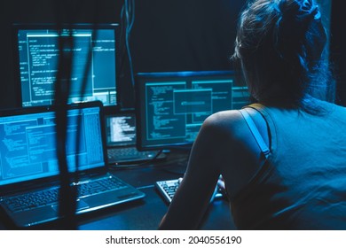 Programmer At Night Develops New Web Desktop Mobile Application Software Developer Freelancer Woman Female  Work With Program Code On Displays At Night Coder Work On Software Program Work On Computer