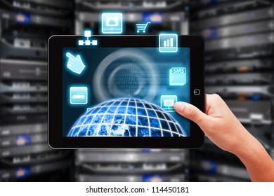 Programmer present the world control through digital touch pad in data center room : Elements of this image furnished by NASA - Powered by Shutterstock