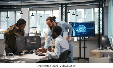 Programmer requests help from team leader to fix hacking attempt on corporate network. IT employee and manager investigating unauthorized access alerts, doing brainstorming, camera A