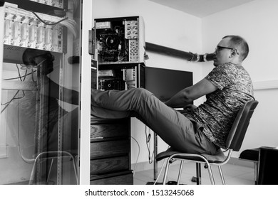 programmer in the server room at the table