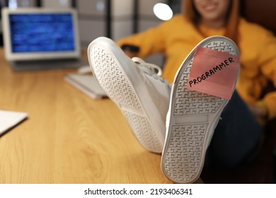 Programmer With Sticky Note On His Shoe In Server Room, Closeup