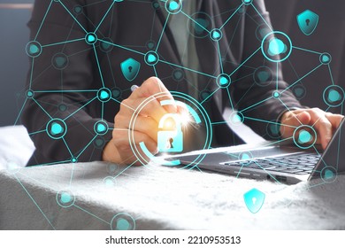 The programmer is typing the code on the keyboard and enabling it to protect cybersecurity from hacker attacks and save customer confidential data. padlock hologram icon above printed hand