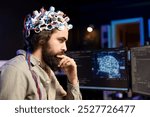 Programmer using EEG headset to upload his mind into computer, attaining immortality. Neuroscientist in apartment experimenting with transferring consciousness into cyberspace