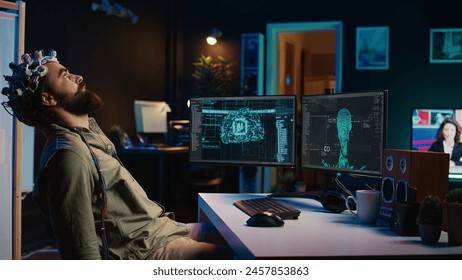 Programmer using EEG headset to upload his mind into computer, attaining immortality. Neuroscientist experimenting with transferring consciousness into cyberspace, camera B
