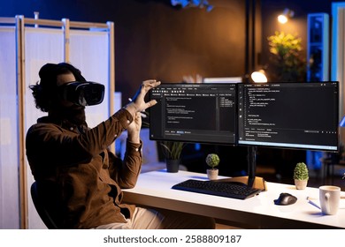 Programmer using high tech VR headset to secure company servers from virus attacks. IT remote employee building firewalls protecting data using futuristic virtual reality technology