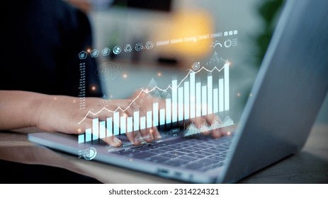  A programmer using a laptop analyzes and development at various information on a futuristic virtual interface screen. Algorithm. marketing and deep learning of artificial intelligence