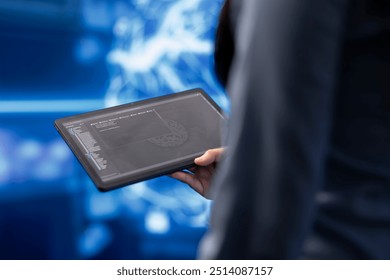 Programmer using tablet to maintenance artificial intelligence neural networks. Close up shot of computer scientist using AI system aiding in processing and transmitting information