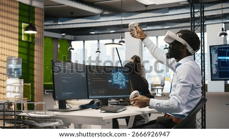 Programmer wearing VR headset at office desk developing programs using AI automation. Startup worker using virtual reality technology, debugging applications with artificial intelligence, camera A