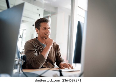 Programmer, web developer, designer working at office comparing mobile and desktop website versions - Powered by Shutterstock